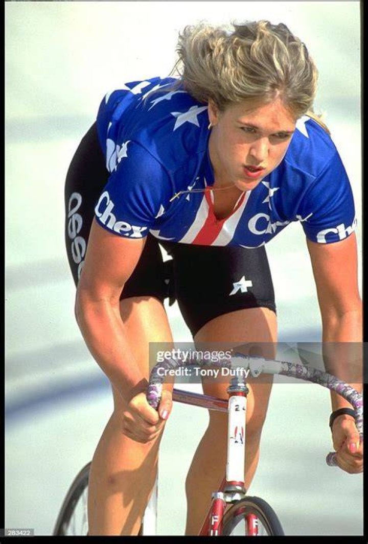 CHERYL BALDINGER, A MODEL RELEASED CYCLIST, RACES AROUND A VELODROME
